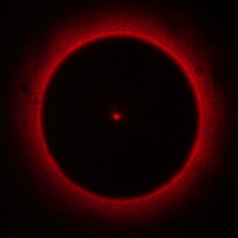 Poisson spot in the shadow of a ball bearing formed by a laser